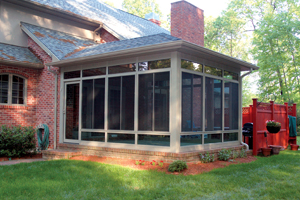 Signature Collecton sunroom addition on back of home